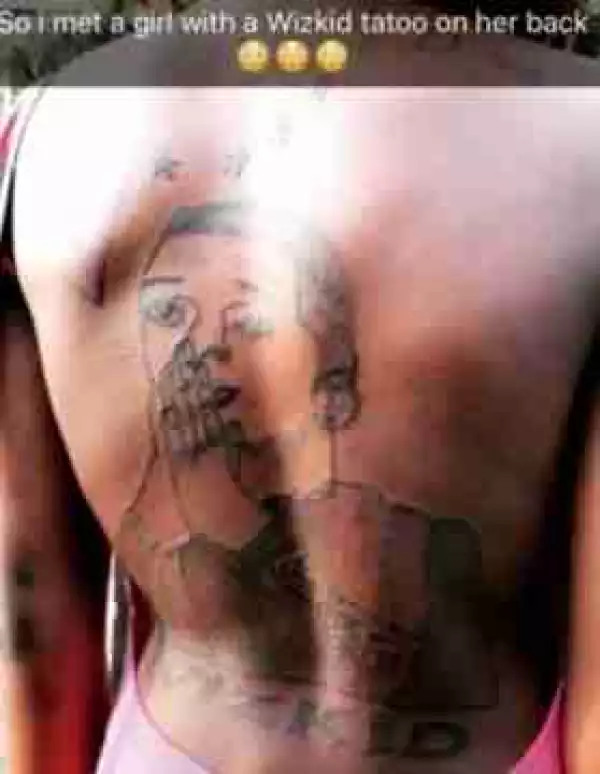 Die-Hard Female Fan Tattoos Picture Of Wizkid On Her Back (Photo)